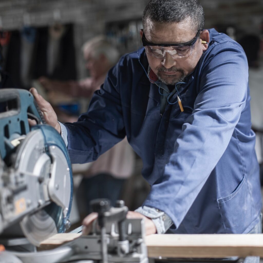 Picture of a man cutting lumber